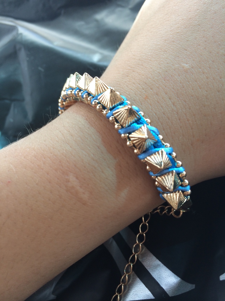 Then, yet another bracelet, even though I don't really wear bracelets. Getting past it getting past it. It has this really pretty shade of blue, so can I ask for more?